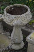 A COMPOSITE PLANTER on a tall shaped support, diameter 44cm x height 72cm