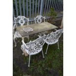 A WHITE PAINTED CAST IRON GARDEN TABLE with a rectangular composite top, length 107cm x depth 56cm x