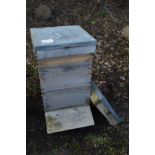 A BRITISH NATIONAL CEDERWOOD BEE HIVE, height 97cm and one spare lid