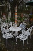A HEAVY ALUMINIUM CIRCULAR GARDEN TABLE, painted in white, diameter 72cm x height 69cm, parasol, and