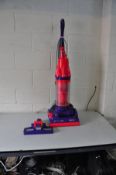 A DYSON DC07 VACUUM CLEANER with matching floor attachment (PAT pass and working)