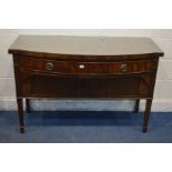A GILL AND REIGATE OF LONDON MAHOGANY BOW FRONT SIDEBOARD/SERVING TABLE, with a single frieze