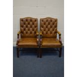 A PAIR OF TAN BUTTONED LEATHER AND MAHOGANY FRAMED OPEN ARMCHAIRS, width 60cm x depth 65cm x