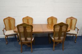 A CONTINENTAL HARDWOOD EXTENDING DINING TABLE, with parquetry top, extended length 223cm x closed