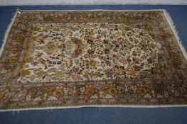 A KIRMAN TREE OF LIFE SILK RUG, cream field with a russet multi strap border, 218cm x 152cm (Sd,