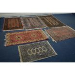 FIVE VARIOUS SIZED TEKKE RUGS, largest rug size 150cm x 99cm, and another rug (6)