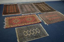 FIVE VARIOUS SIZED TEKKE RUGS, largest rug size 150cm x 99cm, and another rug (6)