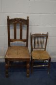 AN EARLY 20TH CENTURY CARVED OAK HALL CHAIR, and a spindle back rush seated chair (2)
