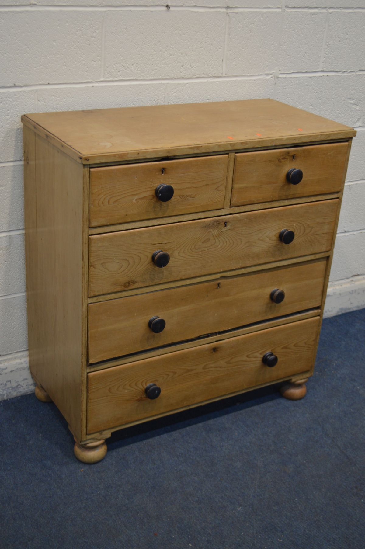 A VICTORIAN PINE CHEST OF TWO SHORT OVER THREE LONG DRAWERS, with turned handles, and flat bun feet,