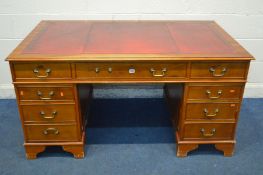 A YEWWOOD PEDESTAL DESK, with a burgundy leather and gilt tooled inlay top, and eight drawers, width