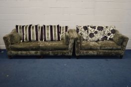 AN UPHOLSTERED TWO PIECE LOUNGE SUITE, with stripped and floral back cushions, comprising a large