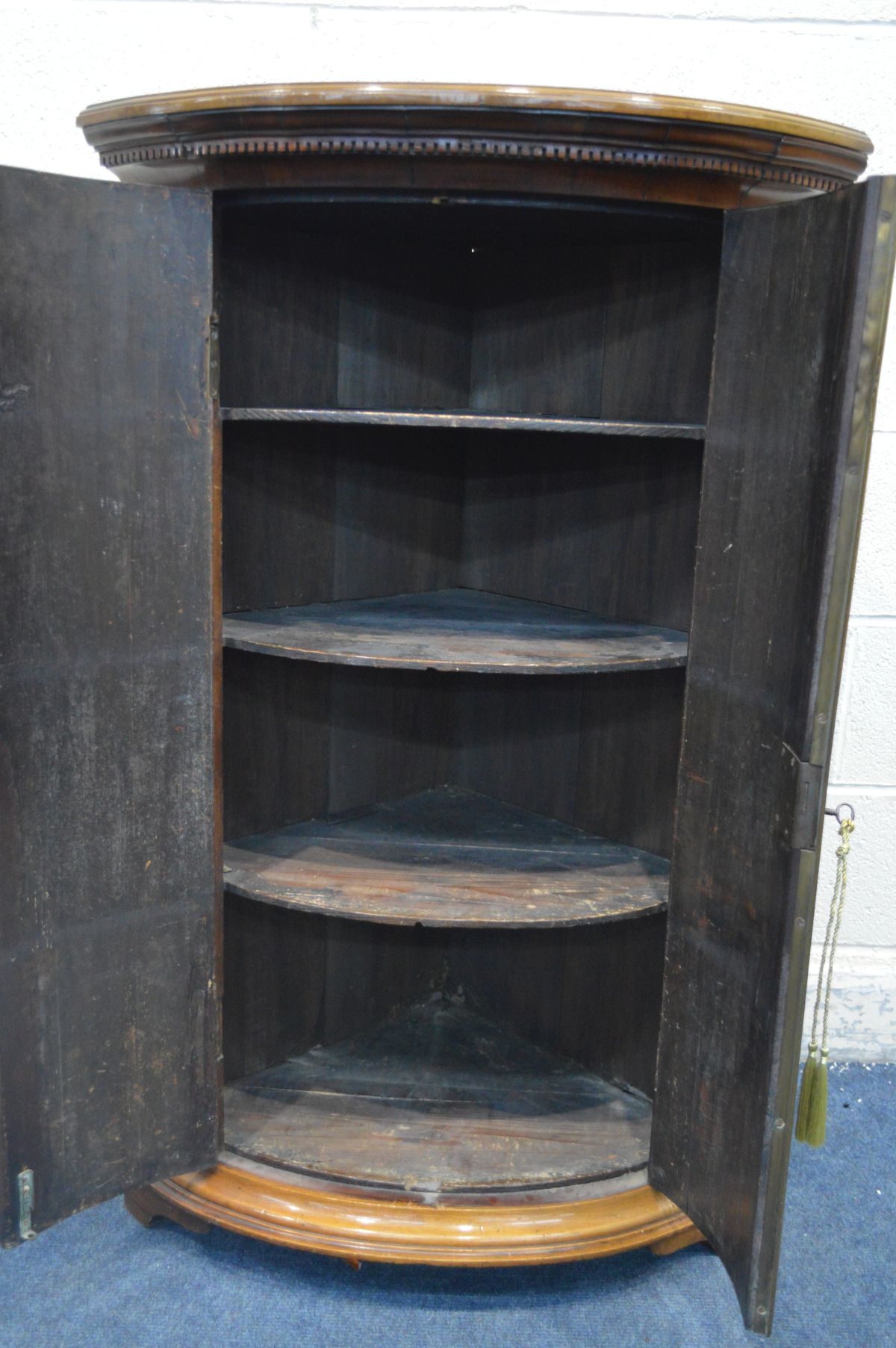 A GEORGIAN STYLE FLAME MAHOGANY BOW FRONT TWO DOOR CORNER CUPBOARD, incorporating older veneers, - Image 3 of 3