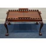 A REPRODUCTION MAHOGANY BUTLERS TRAY, on a separate base, with acanthus knees and ball and claw