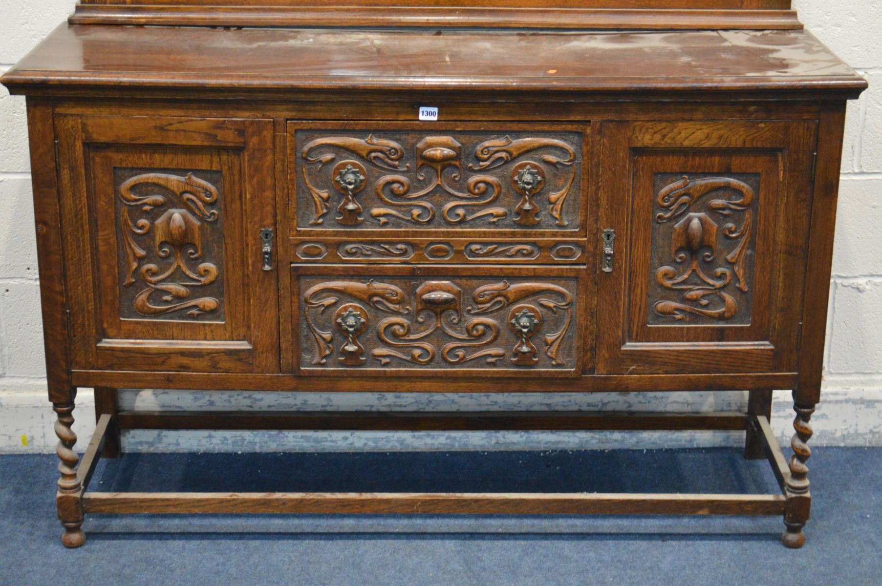 AN EARLY 20TH CENTURY OAK MIRRORBACK SIDEBOARD, with detailed carved panels, barley twist front - Image 2 of 2