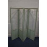 AN EDWARDIAN FOUR FOLDING FLOOR STANDING SCREEN, painted in lime green, with glazed panels, length