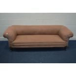 AN EDWARDIAN PINK UPHOLSTERED CHESTERFIELD SOFA, on ceramic casters, width