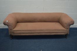 AN EDWARDIAN PINK UPHOLSTERED CHESTERFIELD SOFA, on ceramic casters, width