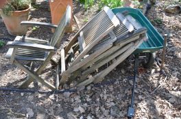 FOUR SLATTED HARDWOOD FOLDING GARDEN CHAIRS and a plastic garden trolley (5)