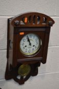 A EDWARDIAN MAHOGANY WALL CLOCK (key and pendulum)