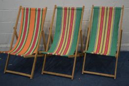 THREE RETRO STRIPPED FOLDING DECK CHAIRS