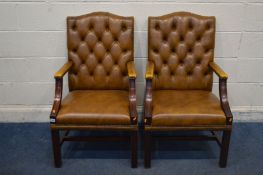 A PAIR OF TAN BUTTONED LEATHER AND MAHOGANY FRAMED OPEN ARMCHAIRS, width 60cm x depth 65cm x