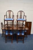 A MAHOGANY TWIN PEDESTAL DINING TABLE with one additional leaf, extended length 155cm x closed