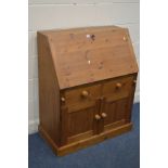 A PINE BUREAU, with a fitted interior and two drawers, width 88cm x depth 47cm x height 109cm (key)