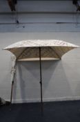 A PAIR OF LARGE GARDEN PARASOLS with Laurent-Perrier to canvas 190cm square at top and 210cm tall