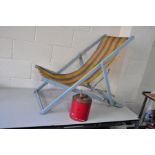 A VINTAGE DECK CHAIR with original striped woven nylon seat and a vintage fuel can (2)