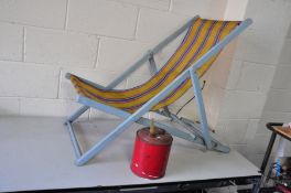 A VINTAGE DECK CHAIR with original striped woven nylon seat and a vintage fuel can (2)