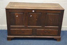 A GEORGIAN OAK MULE CHEST, with a panelled top, triple fielded panel front, above two drawers, width