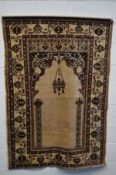 A KAYSERI SILK RUG, with brown and black ground, stylised foliate, scroll and script decoration