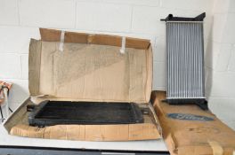 TWO VINTAGE CAR RADIATORS comprising of a Ford Escort Mk4 OVHV in original box and an aftermarket