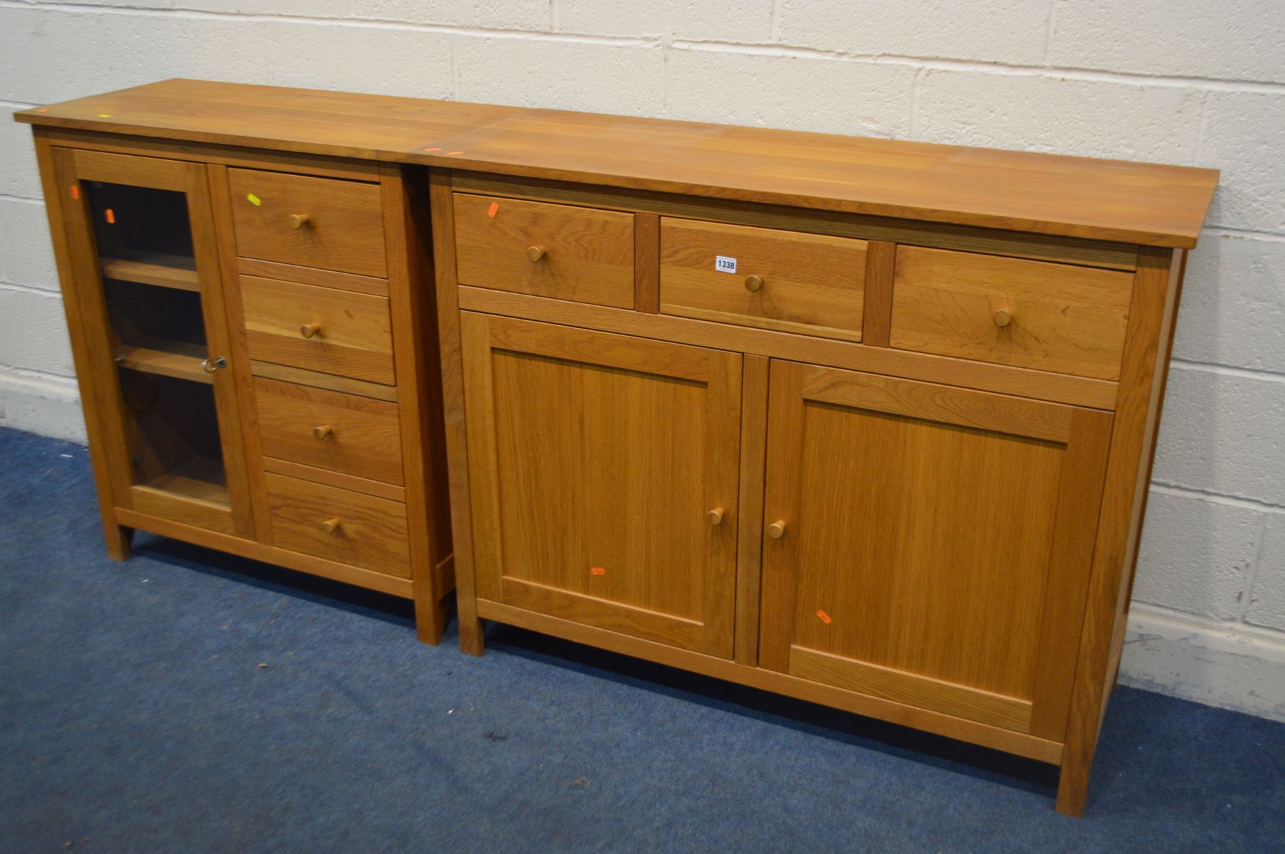 A GOLDEN OAK SIDEBOARD, with three drawers, by Corndell furniture ltd, width 119cm x depth 43cm x