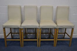 A SET OF FOUR BEECH FRAMED AND CREAM LEATHER HIGH STOOLS