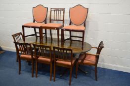 A MAHOGANY TWIN PEDESTAL DINING TABLE, one additional leaf, six chairs together with two shield back