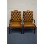 A PAIR OF TAN BUTTONED LEATHER AND MAHOGANY FRAMED OPEN ARMCHAIRS, width 60cm x depth 65cm x