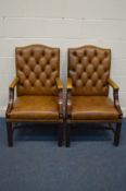 A PAIR OF TAN BUTTONED LEATHER AND MAHOGANY FRAMED OPEN ARMCHAIRS, width 60cm x depth 65cm x