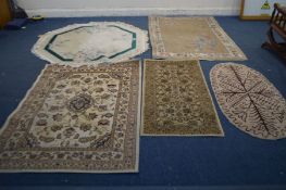 A CREAM AND GREEN WOOLLEN OCTAGONAL RUG, 163cm diameter, another Chinese russet rug and three