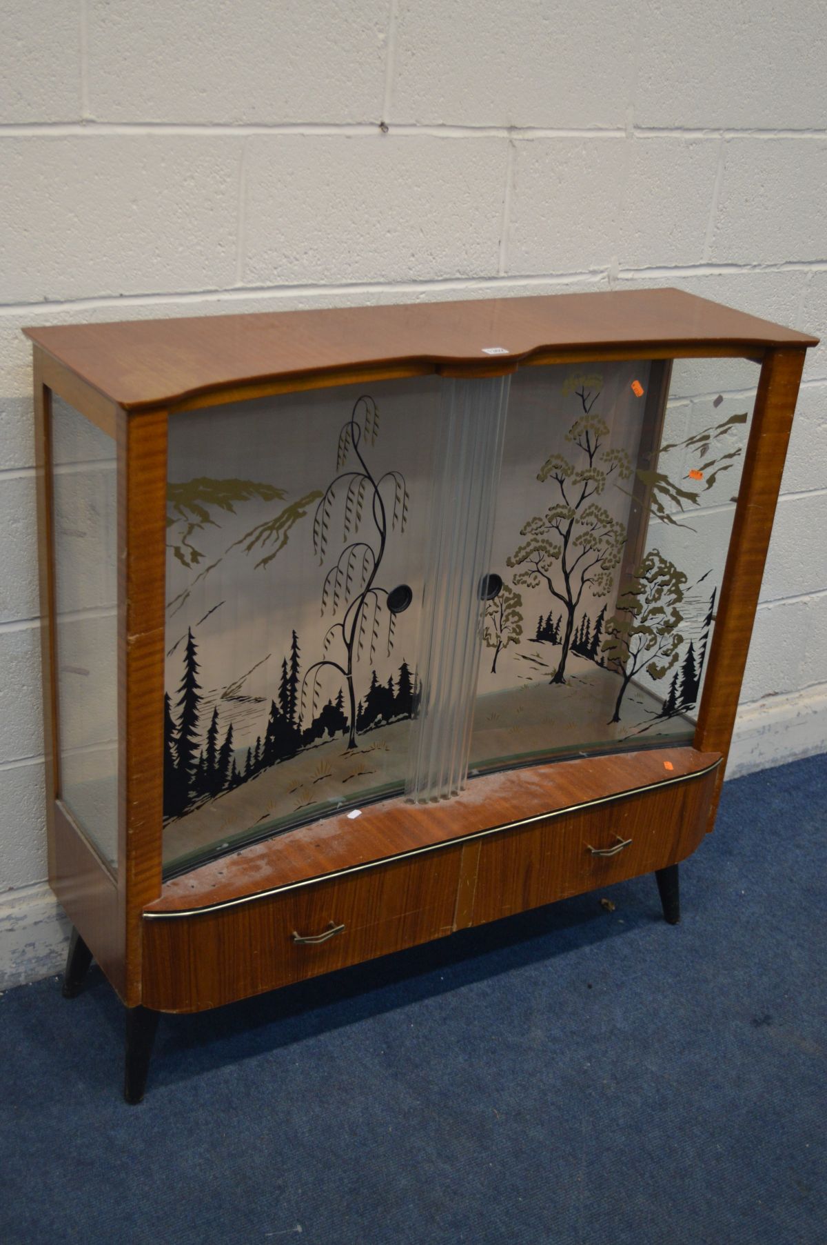 A RETRO TEAK CHINA CABINET, decorated glass doors of a woodland scene, above two drawers, width