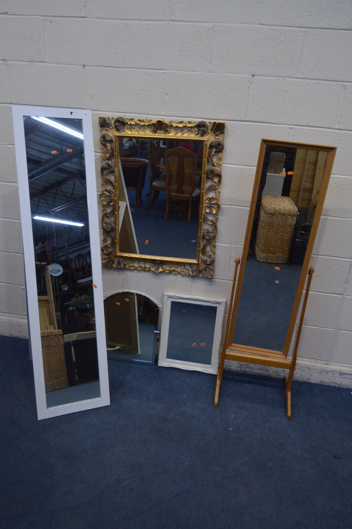 A SCROLLED FOLIATE GILT ON RESIN WALL MIRROR, 71cm x 81cm and two modern cheval mirrors and two