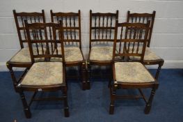 A SET OF EIGHT REPRODUX OAK SPINDLE BACK CHAIRS, including two carvers