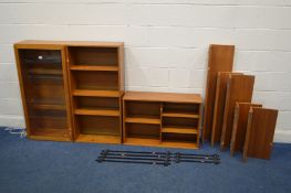 A BEAVER AND TAPLEY 33 TEAK MODULAR WALL SHELVING SYSTEM, comprising of a glazed single door display