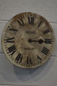 A PAINTED 12INCH CLOCK DIAL with roman numerals and single fusee movement (distressed)