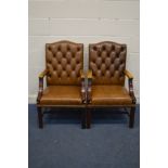 A PAIR OF TAN BUTTONED LEATHER AND MAHOGANY FRAMED OPEN ARMCHAIRS, width 60cm x depth 65cm x