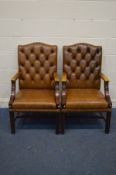 A PAIR OF TAN BUTTONED LEATHER AND MAHOGANY FRAMED OPEN ARMCHAIRS, width 60cm x depth 65cm x