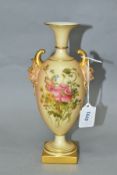 A ROYAL WORCESTER BLUSH IVORY TWIN HANDLED VASE, with mask handles, printed and tinted with floral