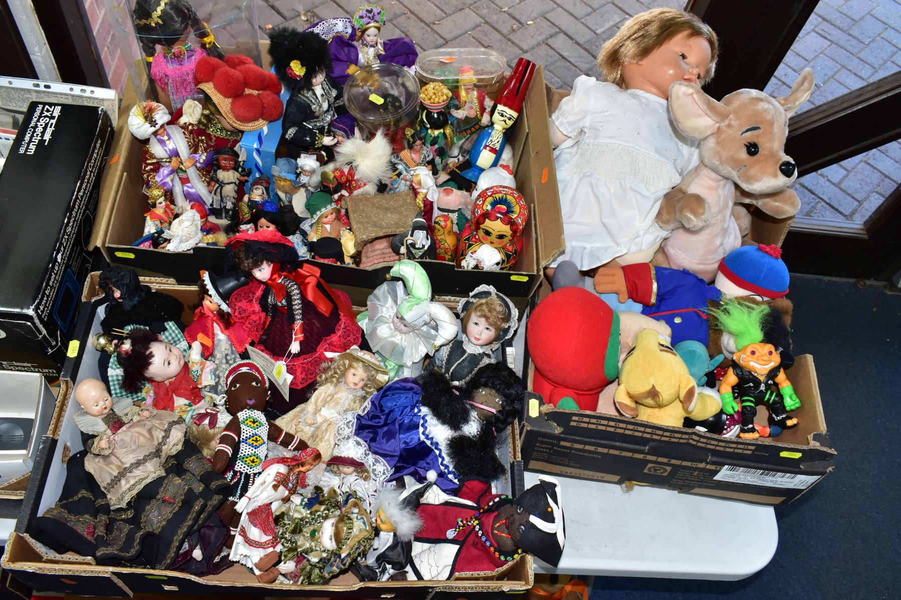 THREE BOXES OF DOLLS, COSTUME DOLLS AND SOFT TOYS, including Disney and South Park characters,
