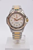 A TAG HEUER 4000 SERIES QUARTZ WRISTWATCH, silvered dial, gold coloured baton and arrow markers,