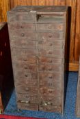 A LATE 19TH CENTURY PINE BANK OF TWENTY FOUR DRAWS, all draws with dividers, one draw missing,